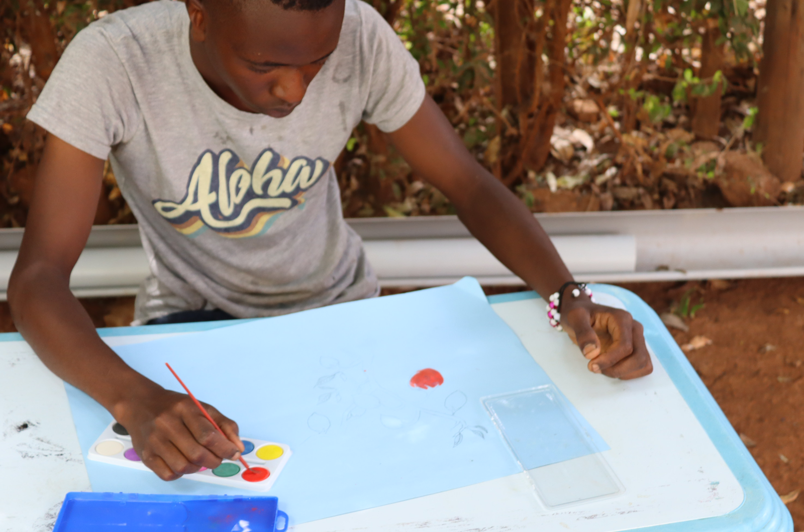 Young participants engage in a drawing exercise to identify the talented ones.