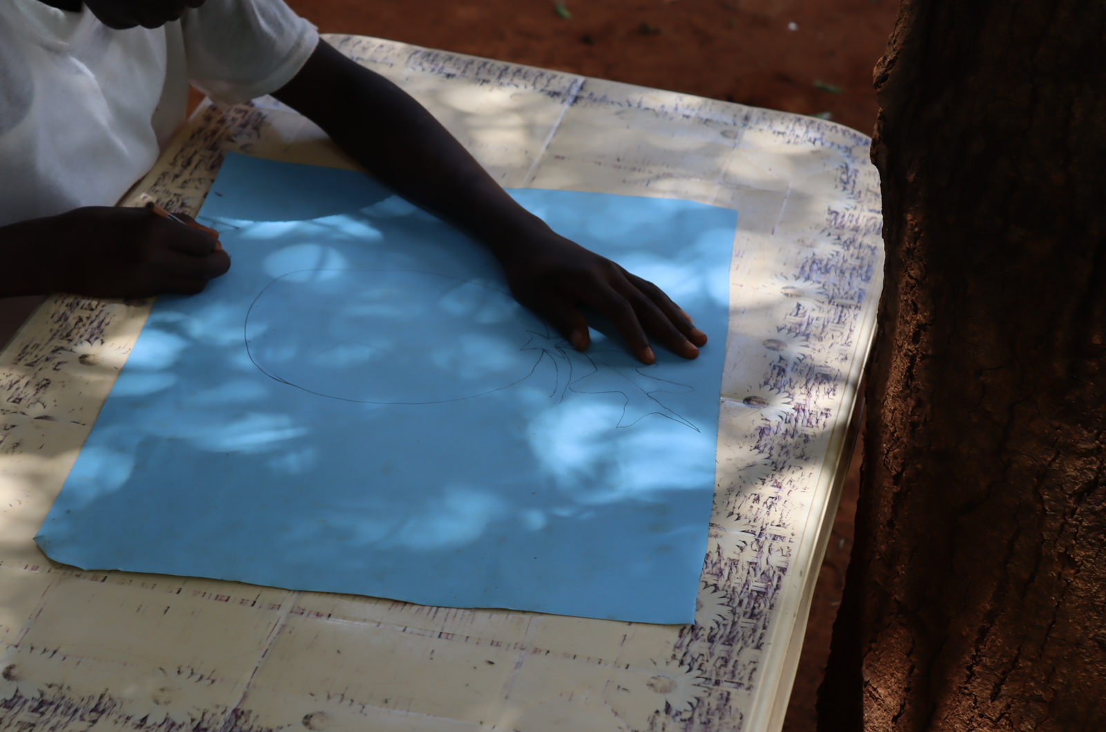 Young participants engage in a drawing exercise to identify the talented ones