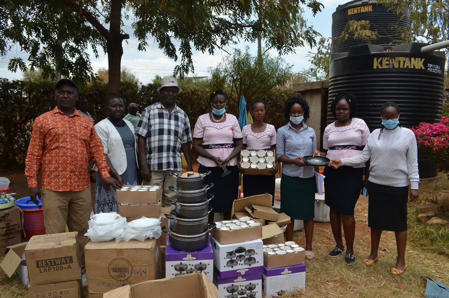 Umoja Women group receives cooking utensils from the project management